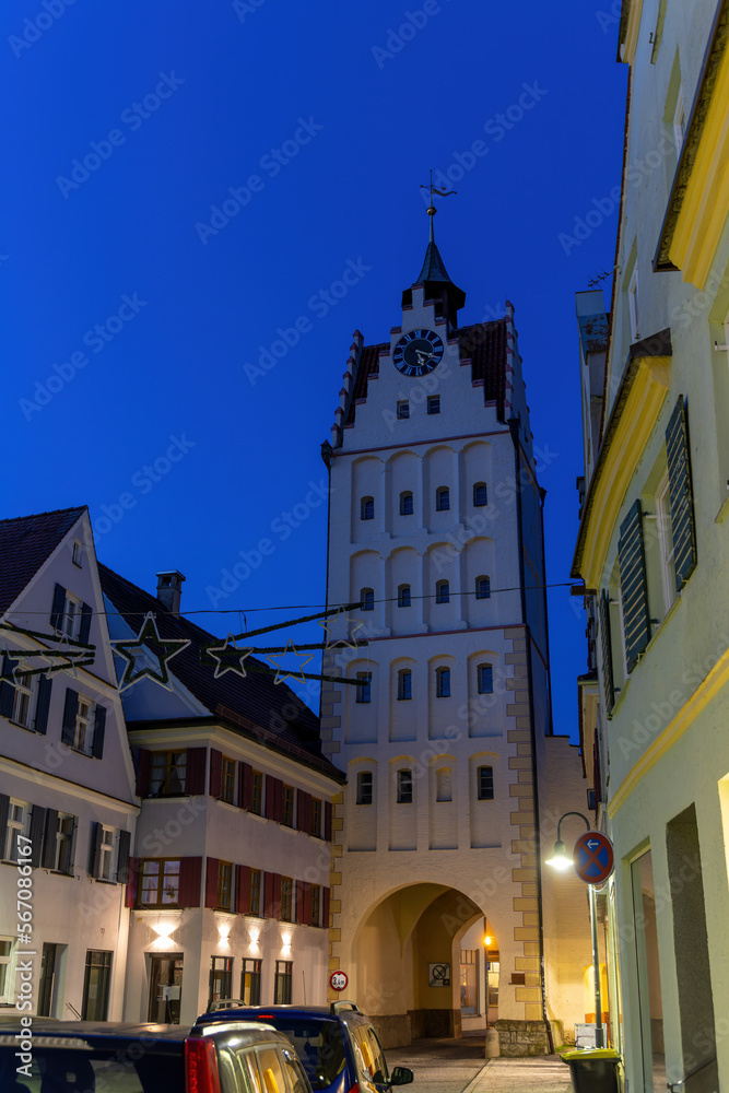 old, historic watchtower in Weissenhorn with Christmas decorations and an evening mood
