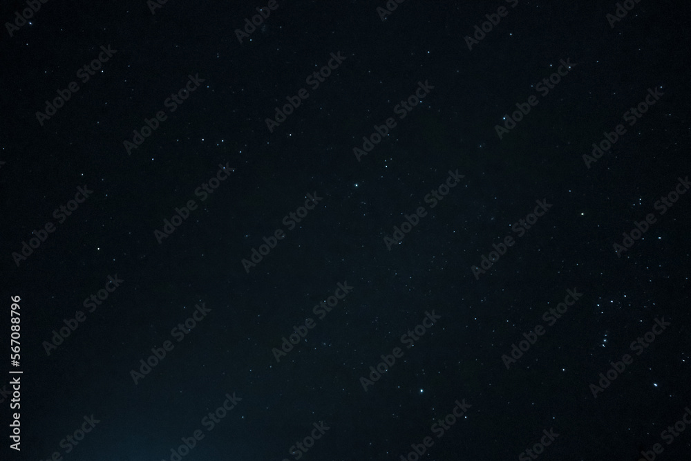 Starry space background in the night. Space stars texture. Colorful stars in the night sky
