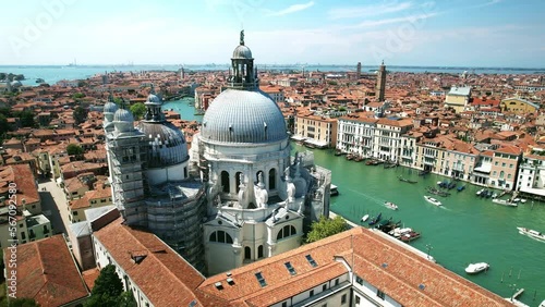 Drone Venice Italy 4k. Salute Basilica church, old architecture on Grand canal. Romantic honeymoon tourism landmark in Italy. Famous cruise destination in Europe. 