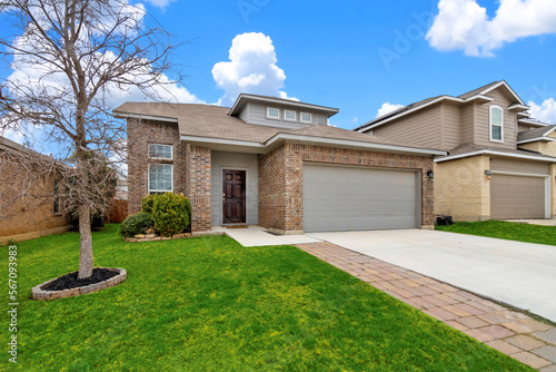 Fototapeta House with a green lawn