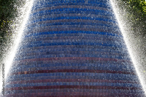 Detail of spray coming off of fountain made of colorful tiles in Lisbon, Portugal.