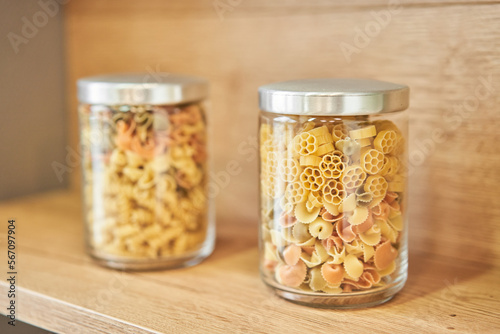 Pantry food cabinet. Kitchen storage organization. Pasta, grains in glass jars. Organic food. Home cooking. Nutrition food. Glass containers. Food preparation. Zero waste, plastic free. 
