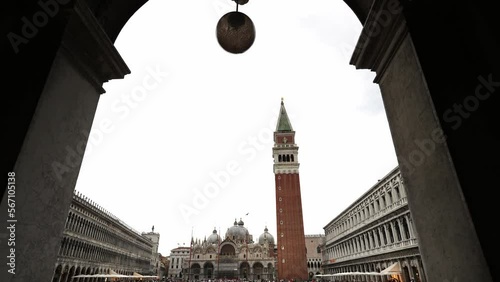 St Mark's Square, seen thru the arches. Piazza San Marco, St. Mark’s Basilica. Famous landmark in Venice, Italy. Romantic honeymoon, cruise ship destination in Europe.  photo