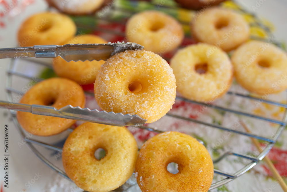 Mini Donut Sugar brown, Fresh donuts in cooling rack. Mini Donut Sugar brown, Fresh donuts in cooling rack.