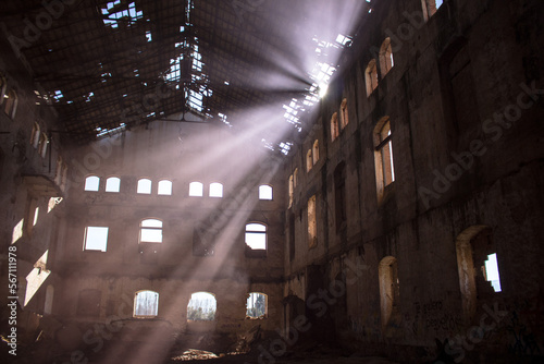 Abandoned warehouse in Guadix through which rays of light enter