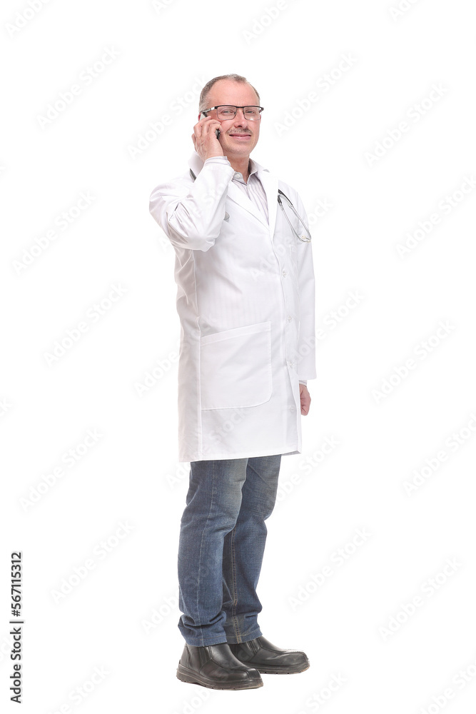 Side view of good looking male doctor using or speaking over or presenting smartphone Side view of good looking male doctor using or speaking over or presenting smartphone