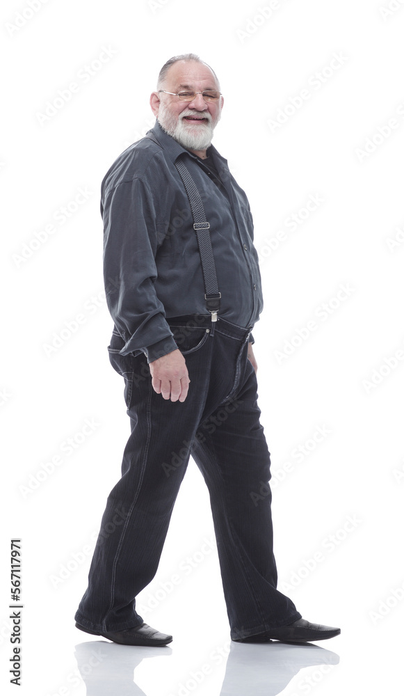 in full growth. happy bearded man striding forward. in full growth. happy bearded man striding forward.