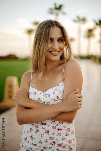 portrait of a beautiful woman on the background of palm trees