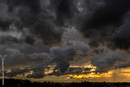 Dark clouds and rainy over the city in Brazil at a sunset