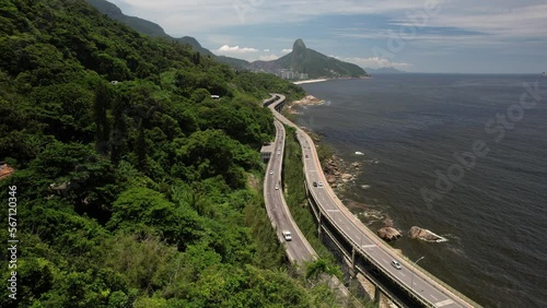 Aerial drone orbit of Elevado do Joa in Rio de Janeiro, Brazil, a complex of tunnels, bridges and viaducts that connects the south and west zones of the city of Rio de Janeiro on the Atlantic coast photo