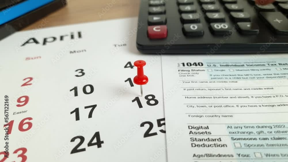 Tax payment day marked on a calendar - April 18, 2023 with 1040 form, financial concept Tax payment day marked on a calendar - April 18, 2023 with 1040 form, financial concept