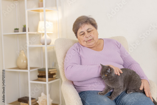 elderly people take care of cats and enjoy them at home