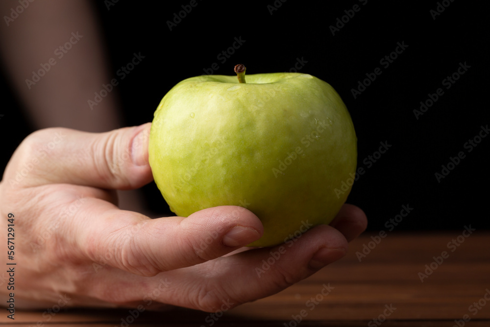 Green apples, Granny Smith, on a dark background.Fresh apples for sale. Green apples, Granny Smith, on a dark background.Fresh apples for sale.