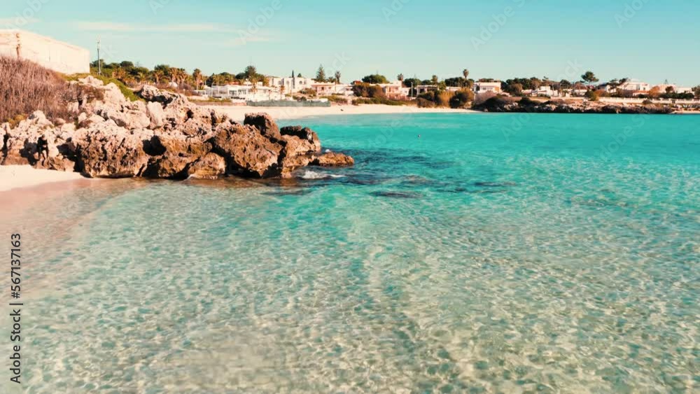 Salento, spiaggia con mare blu cristallino, marina di pulsano, Taranto, Puglia, Italy - drone 4K