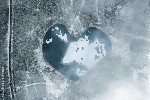 Wallpaper Mural Aerial image of a heart shaped frozen lake surrounded by snow covered forest, Torontodigital.ca