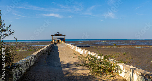 A small jetty in Koteshwar in the Kori Creek at low tide in the western most corner of India in Gujarat state photo