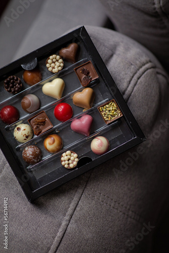 Assorted Valentine’s Day chocolates. Chocolate chocolates in different colors. Heart shaped chocolates. Candy box with sweets