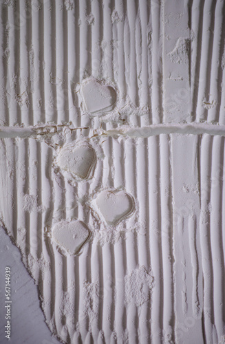Obraz na płótnie Valentine’s Day. Creative expression. Traces in the shape of a heart white. Lines and shadows. Valentine’s Day card. Heart in white flour w salonie