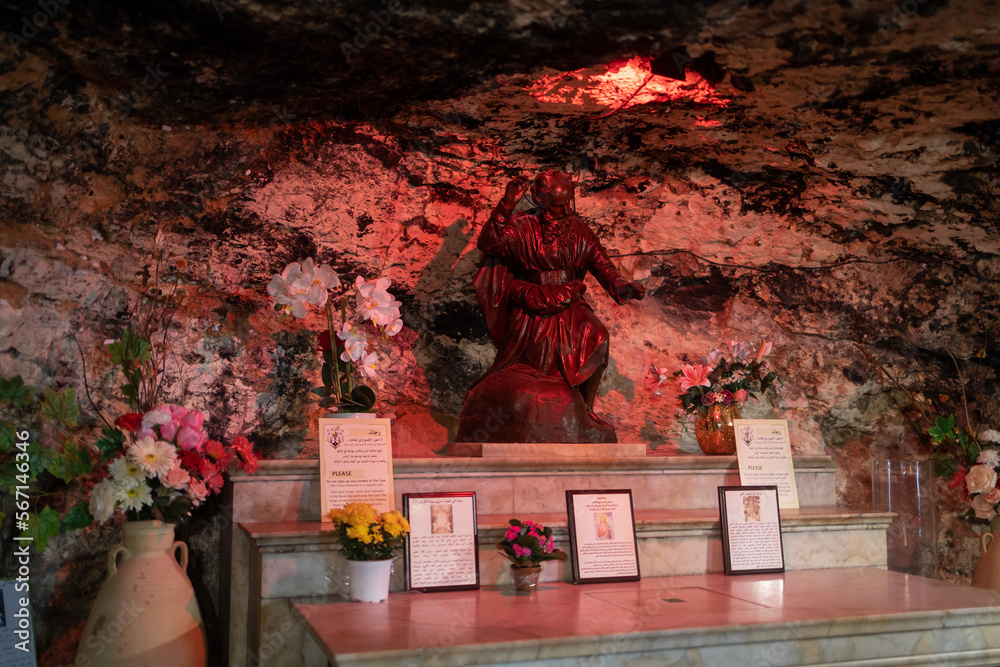 Haifa, Israel, January 10, 2023 : The altar hollowed out in the rock in the Stella Maris Monastery which is located on Mount Carmel in Haifa city in northern Israel - obrazy, fototapety, plakaty 