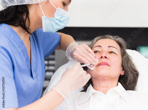 Mature woman getting ready for plastic surgery