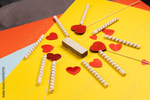 Valentine's Day. Frame of gifts, candles, confetti on a colorful background. Valentine's day background.