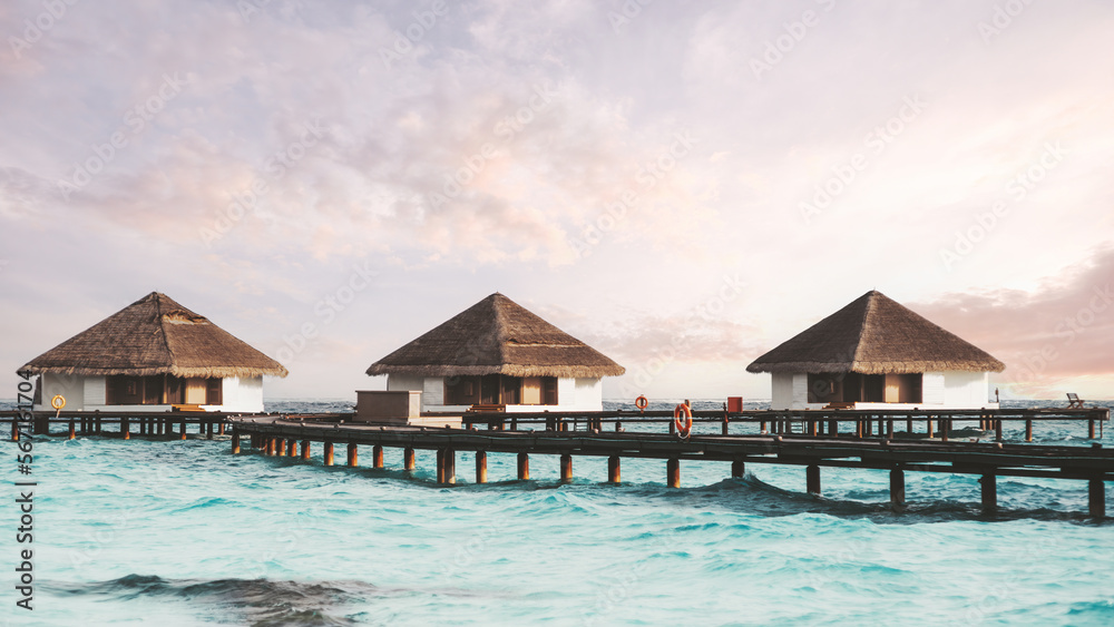A wide-angle shot of a group of three overwater bungalows with thatched roofs connected via a wooden boardwalk in the background on a beautiful afternoon with some clouds in the lilac color sky