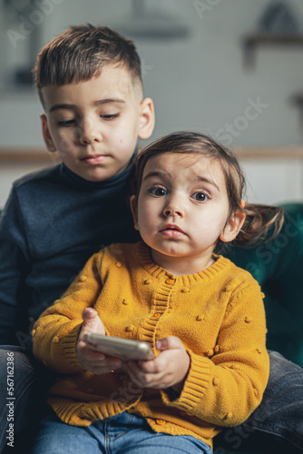 Kids using device at home.