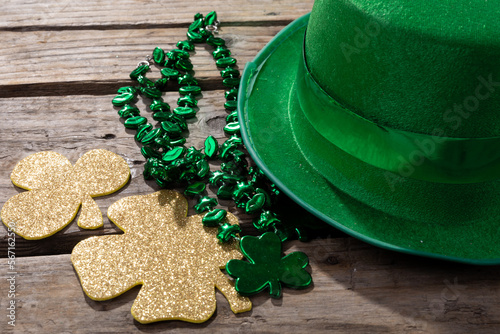 Top view photo of st patrick's day decorations with copy space on wooden surface