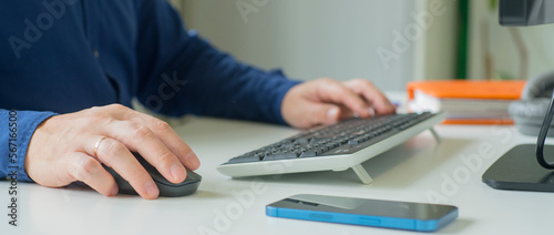 male hands work on the keyboard in the office.person working in the office.business banner background