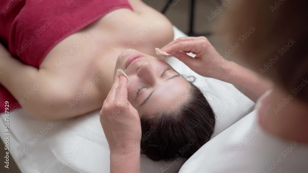 Relaxing facial massage of a beautiful young girl Relaxing facial massage of a beautiful young girl