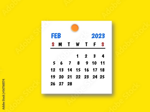 The February 2023 and wooden push pin on yellow background.