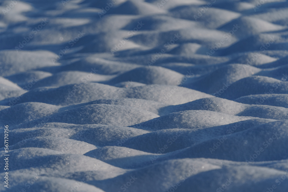 Smoothly undulating, white surface of frozen snow.