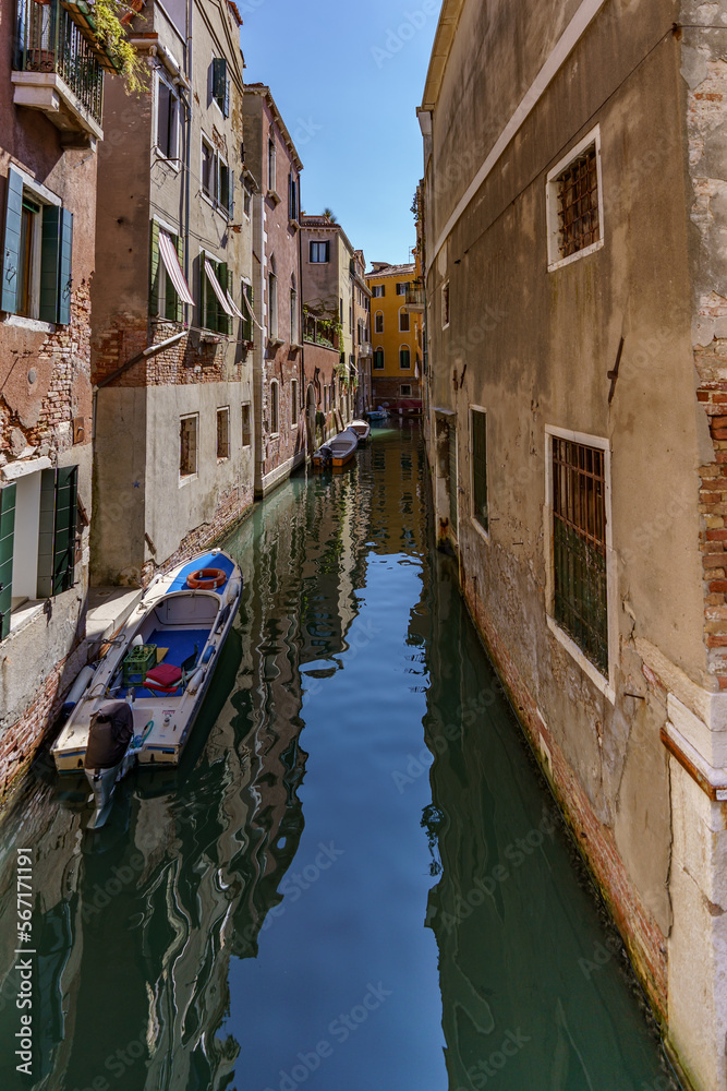 A view of the narrow Venetian water channels winding tightly between the buildings
