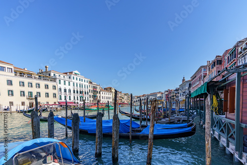 View of moored Venetian gondolas waiting for tourists