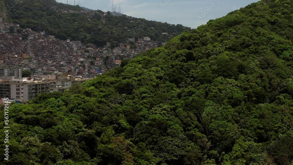 Aerial drone reveal of Rocinha favela near Sao Conrado in Rio de Janeiro, Brazil. Rocinha is the largest shanty town in Latin America housing around 70,000 inhabitants Aerial drone reveal of Rocinha favela near Sao Conrado in Rio de Janeiro, Brazil. Rocinha is the largest shanty town in Latin America housing around 70,000 inhabitants