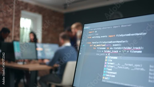 program code writing on display of computer in office, data scientist and software developer work