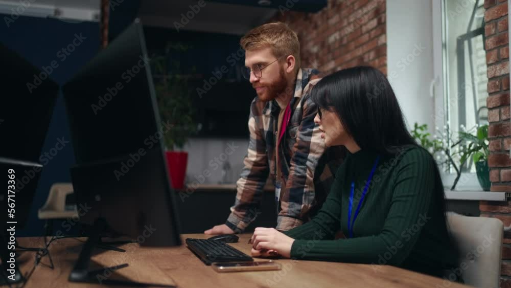 data mining and machine learning department, two programmers discussing, man and woman