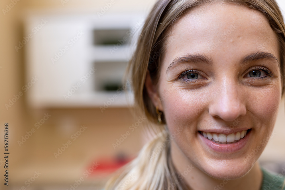 Close up portrait of smiling blonde caucasian woman in kitchen at home, copy space Close up portrait of smiling blonde caucasian woman in kitchen at home, copy space