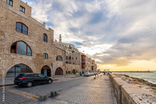 The old city of Jaffa, Israel, with medieval stone buildings along the Mediterranean Sea as the sun sets at the ancient port city.  © Kirk Fisher