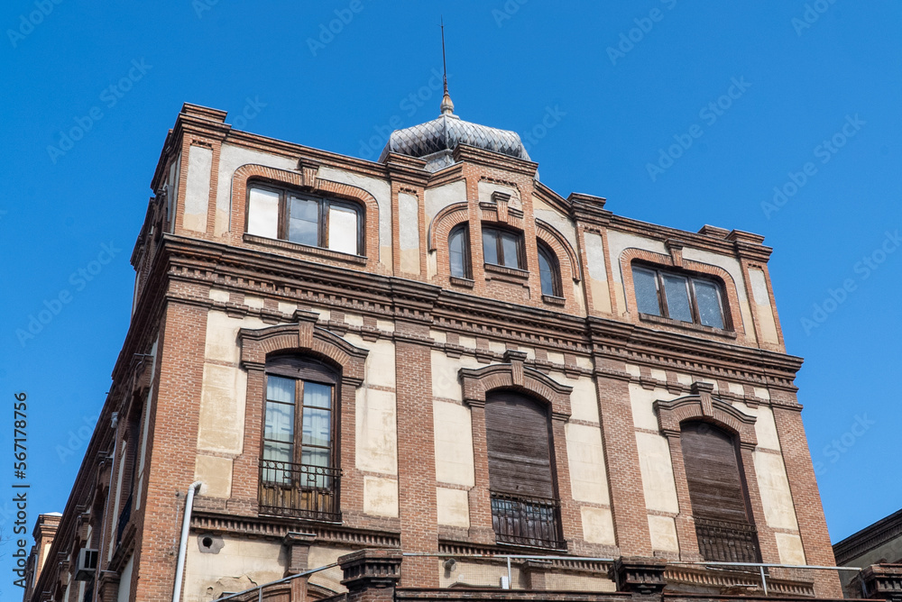 Madrid, Spain. April 6, 2022: architecture and facade of houses with beautiful blue sky.