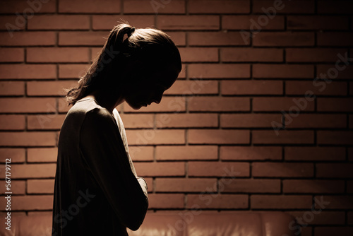 Unhappy woman at home suffering from depression, sadness, divorce, loneliness photo
