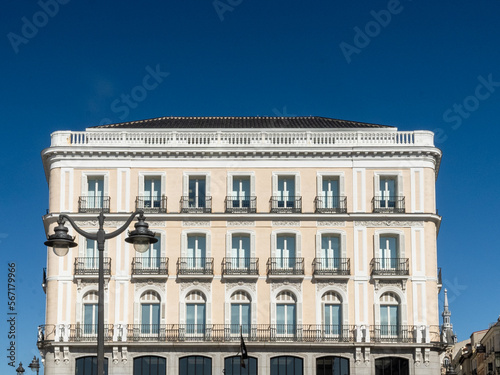 Madrid, Spain. April 6, 2022: architecture and facade of houses with beautiful blue sky.