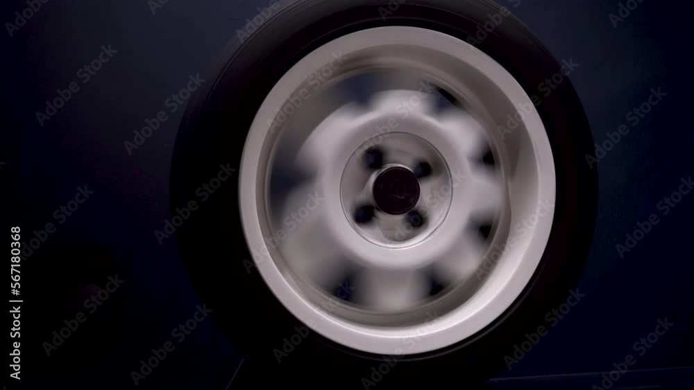 spinning car wheels white shooting video on long exposure motion effect spinning car wheels white shooting video on long exposure motion effect
