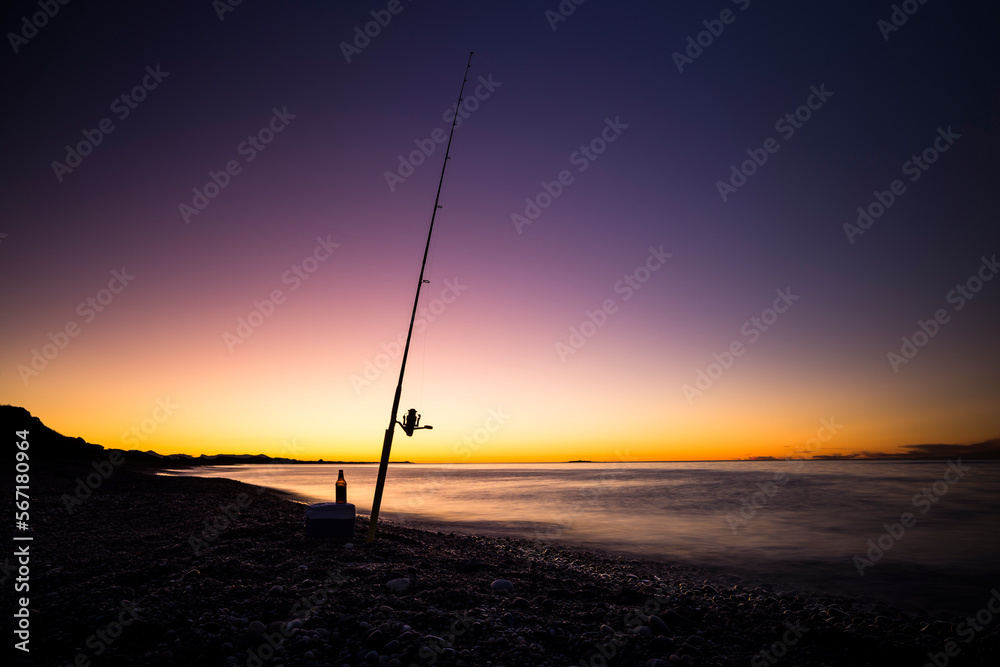Colourful sunset while fishing off Tasmanian beach. Colourful sunset while fishing off Tasmanian beach.