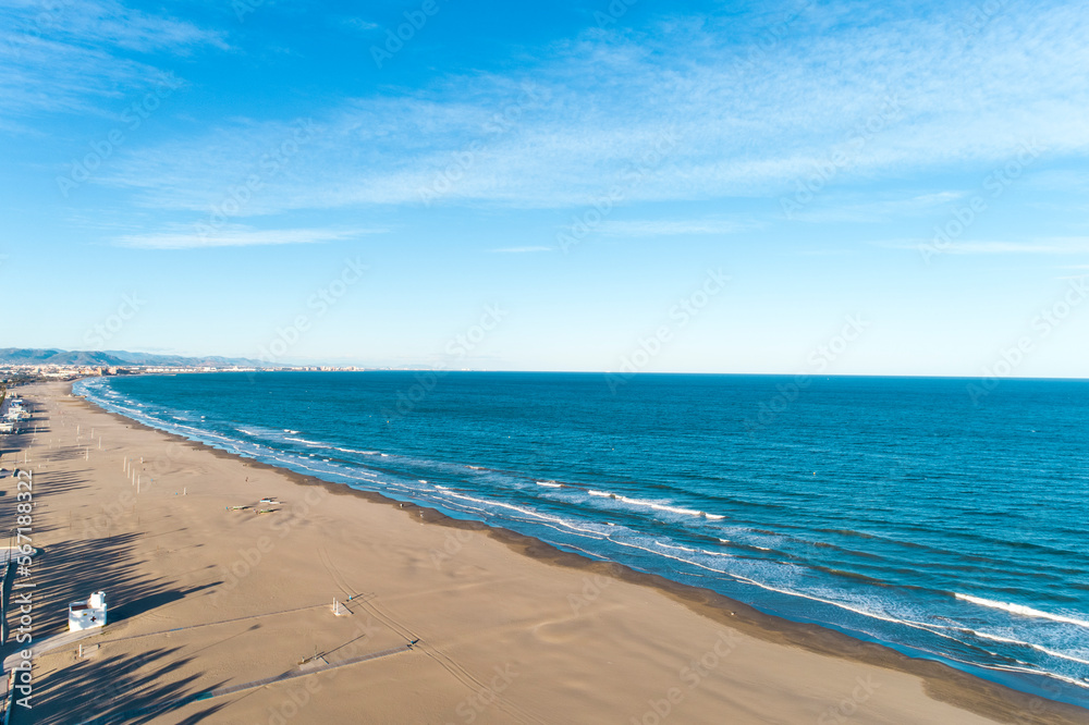Aerial view of the beach of valencia and the coastline, late afternoon with waves, Spain Aerial view of the beach of valencia and the coastline, late afternoon with waves, Spain