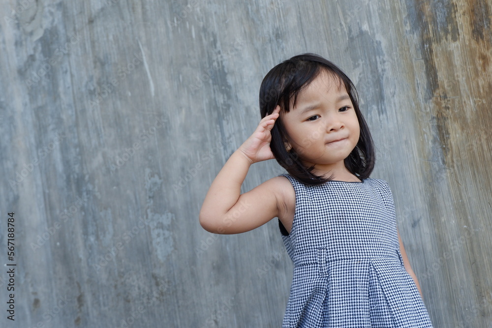 expressive girl in front of greyish wall expressive girl in front of greyish wall