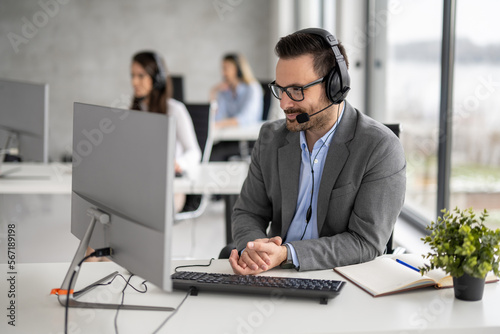 Photography Technical service support operator listening carefully to client during telephon