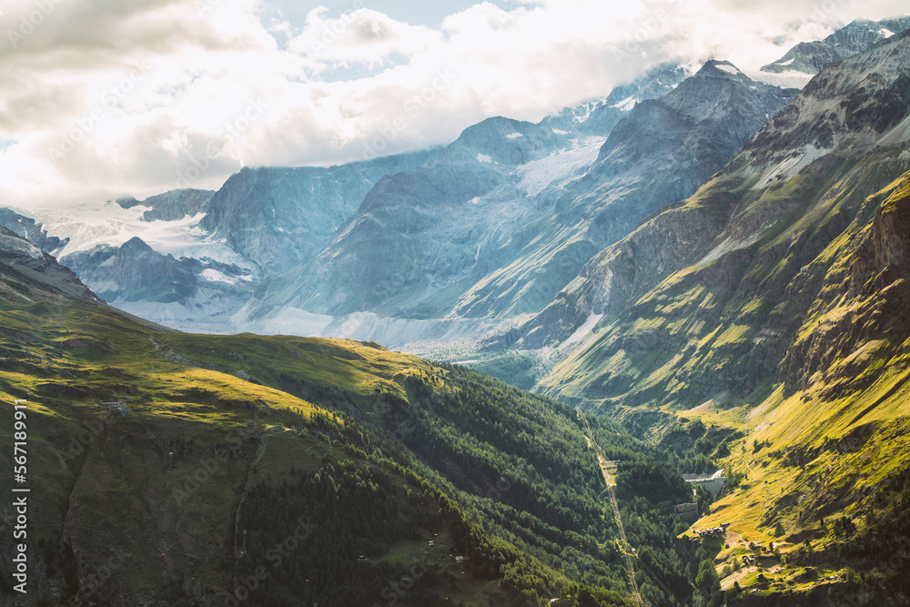 Fototapeta Valley in the alps surrounded by mountains in summer near Zermatt in Switzerland