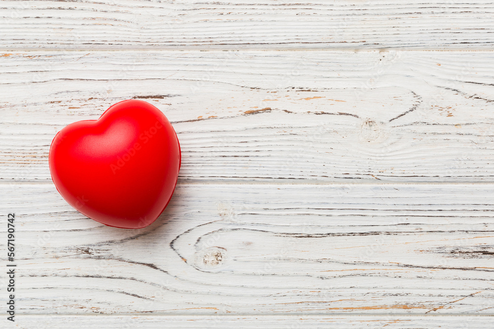 red heart shape on colored background. minimal concept top view with copy space red heart shape on colored background. minimal concept top view with copy space