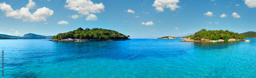 Beautiful Ionian Sea with clear turquoise water and morning summer coast. View from Ksamil beach, Albania.